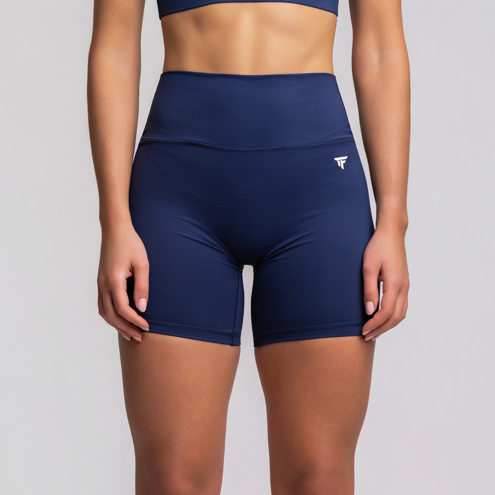 Front view of TONEFIT women’s 5-inch V-waist navy blue performance shorts