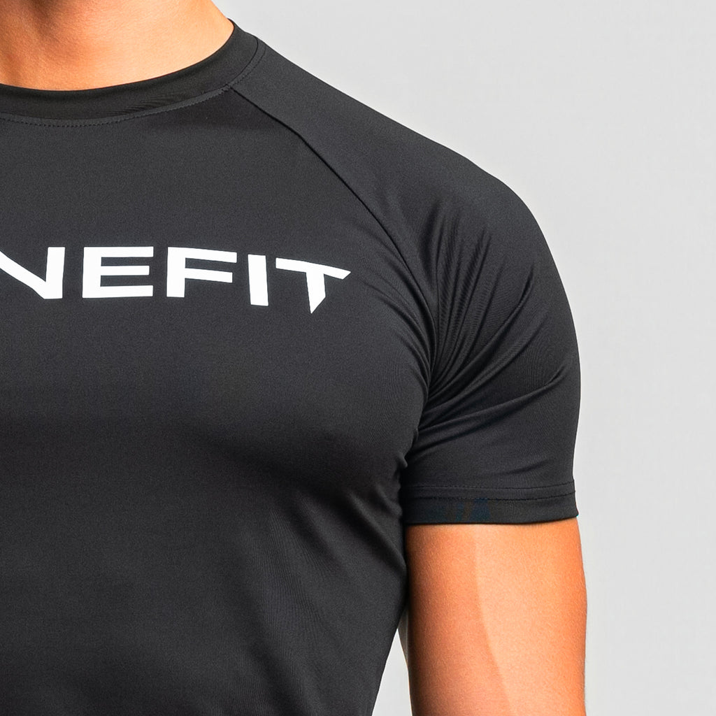 Detail shot of TONEFIT gunpowder men’s t-shirt showcasing tonal logo and stitching.