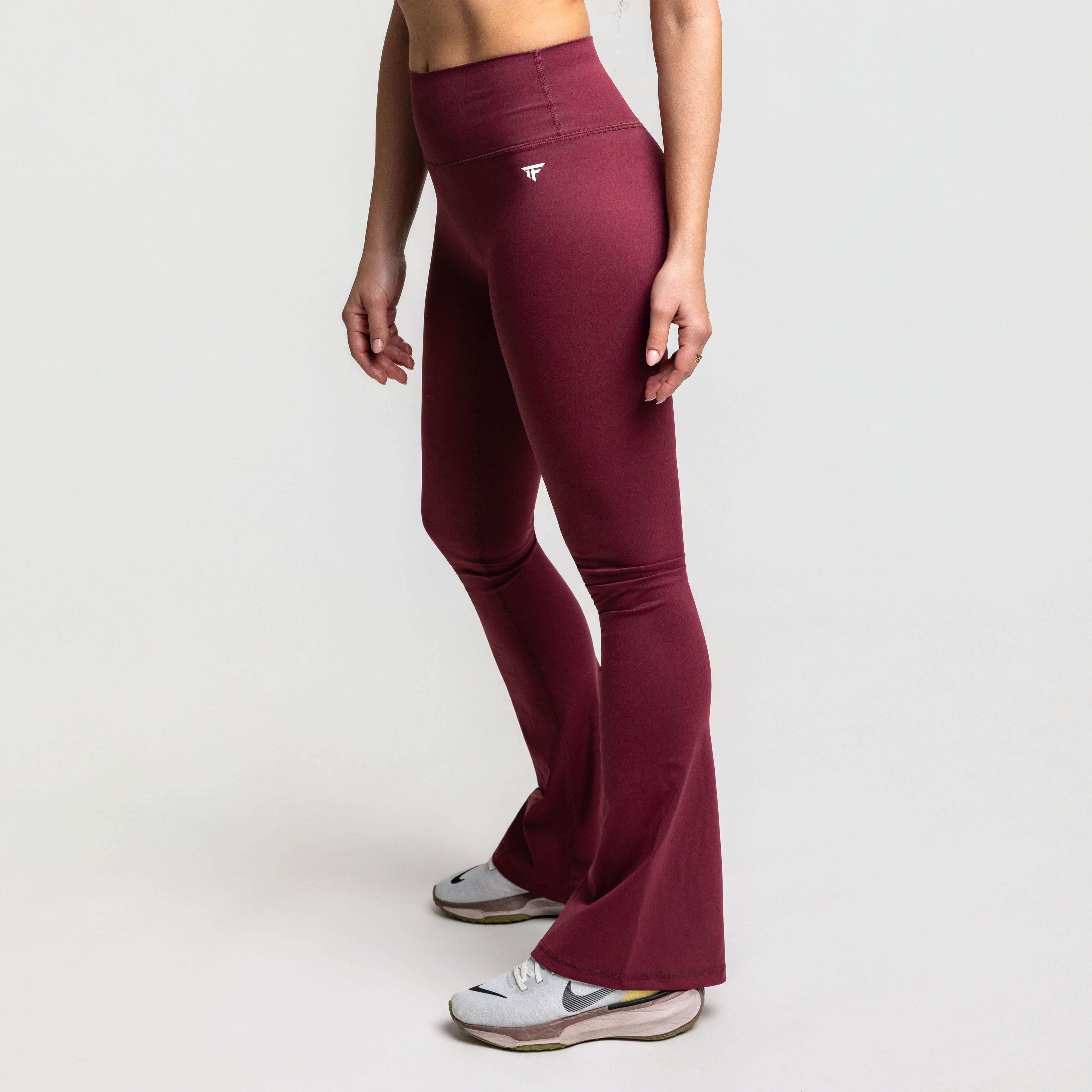 High waisted flare leggings in maroon color, featuring a modern design for studio and street transitions.