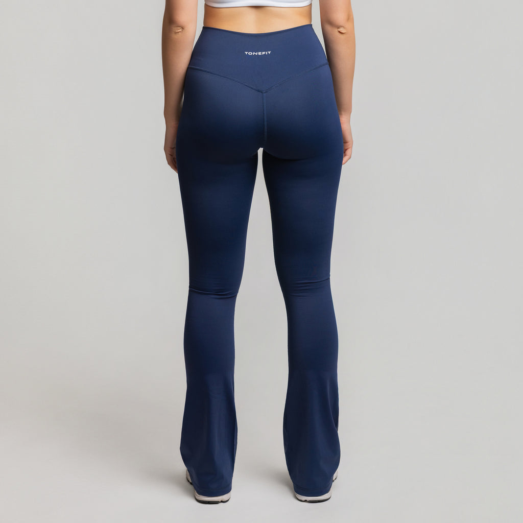 Back view of Deep Sapphire Flare Leggings showing seam detailing and high-rise sculpt