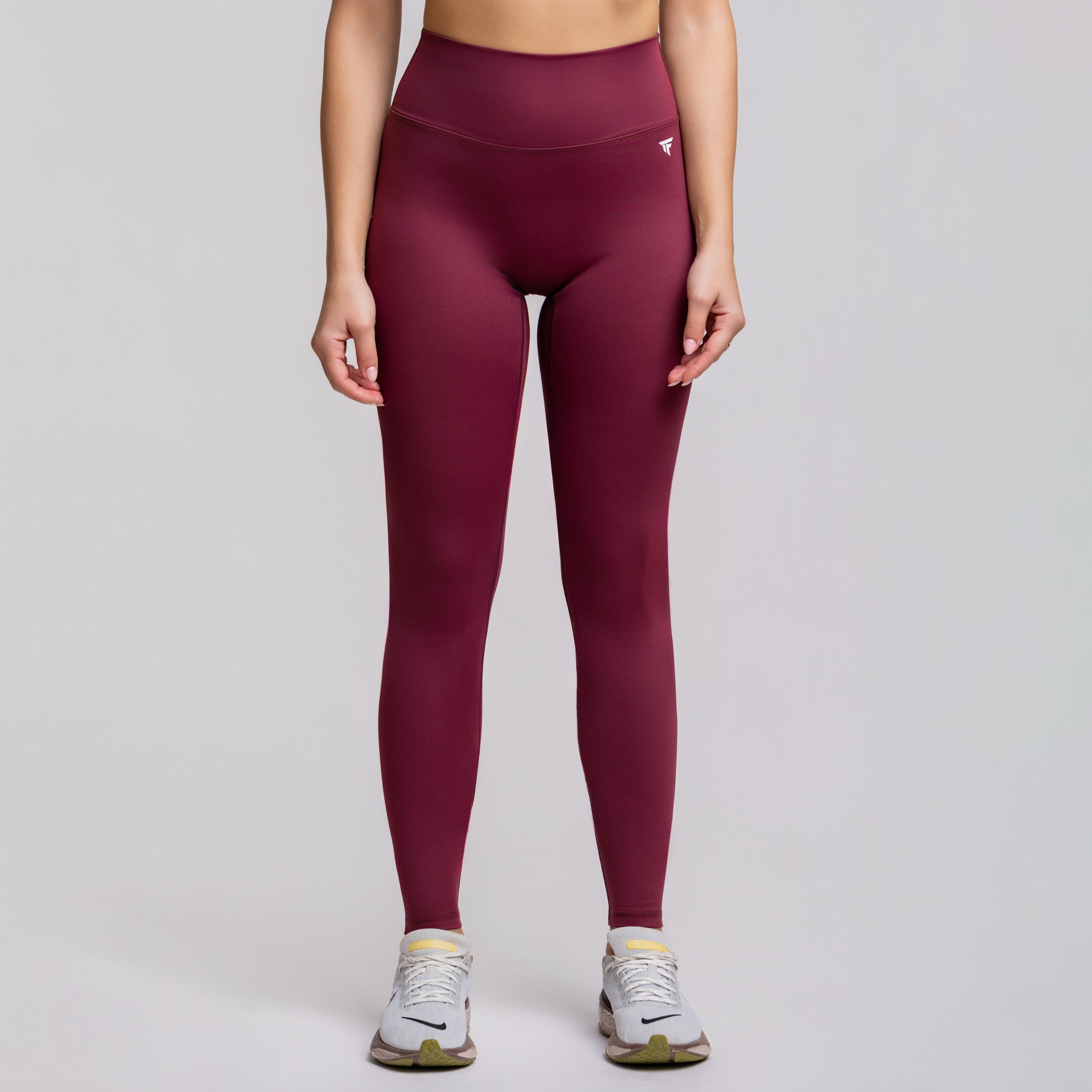 Front view of TONEFIT V-Waist Sculpt Leggings in Dark Plum highlighting high waist and sleek design