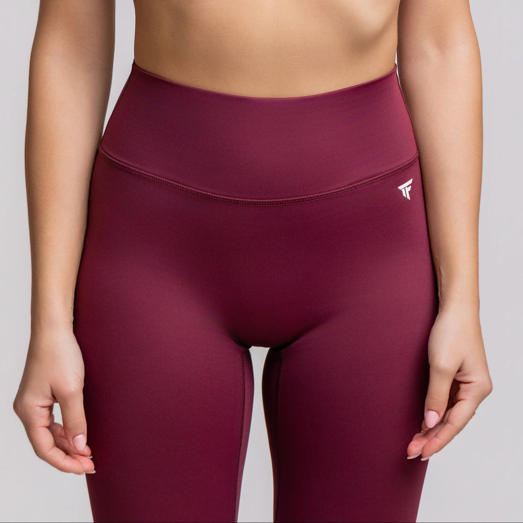 Front close up view of TONEFIT V-Waist Sculpt Leggings in Dark Plum highlighting high waist and sleek design