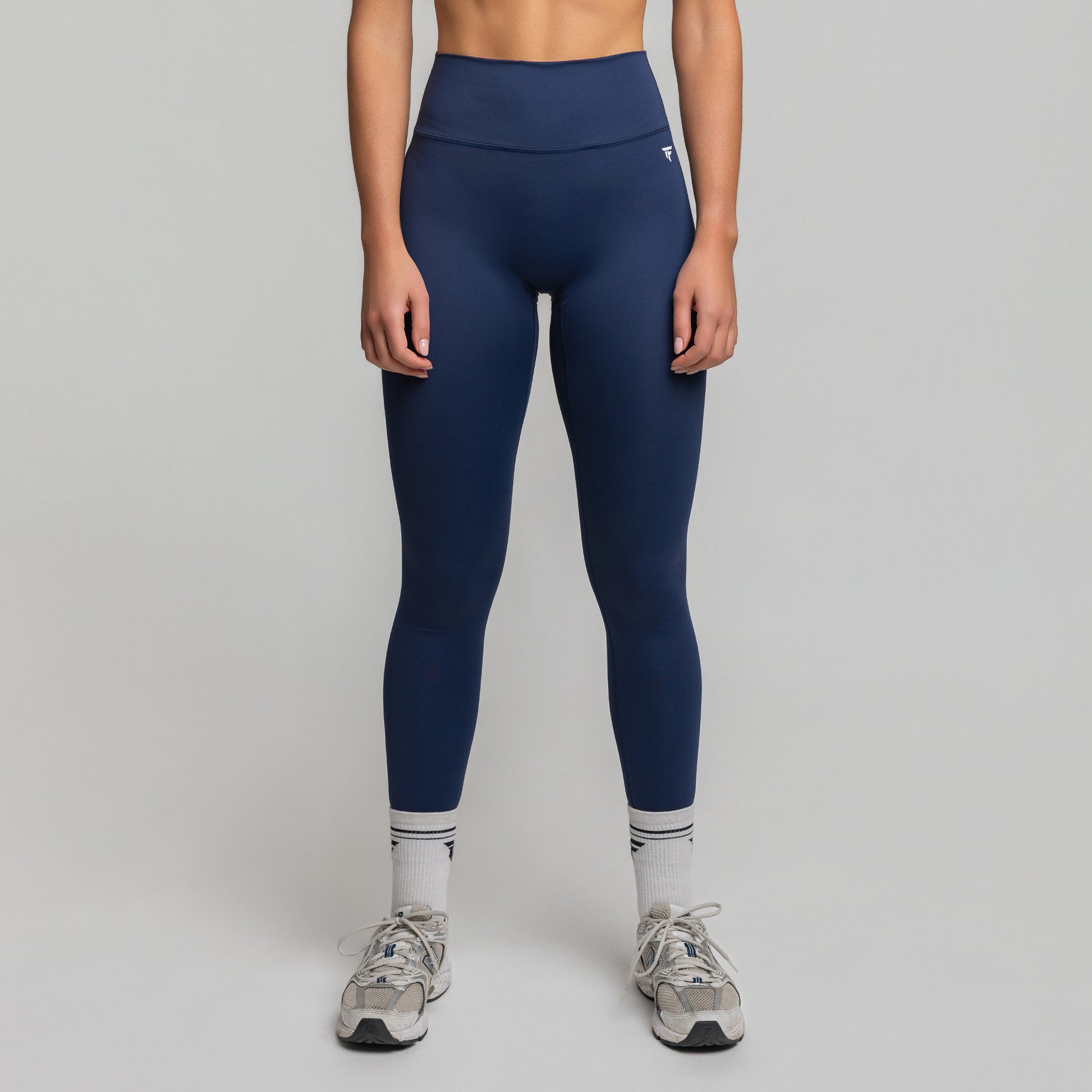 Front view of TONEFIT women’s V-Waist Sculpt Leggings in Deep Sapphire showing high-rise fit and full-length coverage