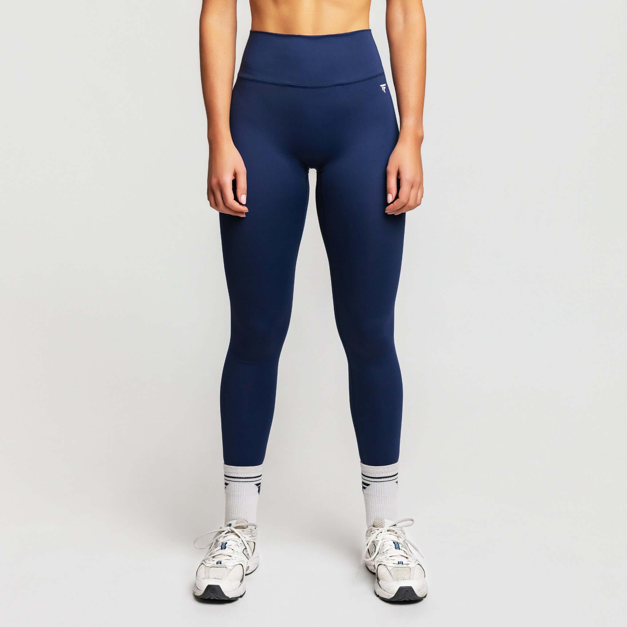 Model wearing V-waist sculpt leggings in navy blue, high-waisted design for optimal performance and style.