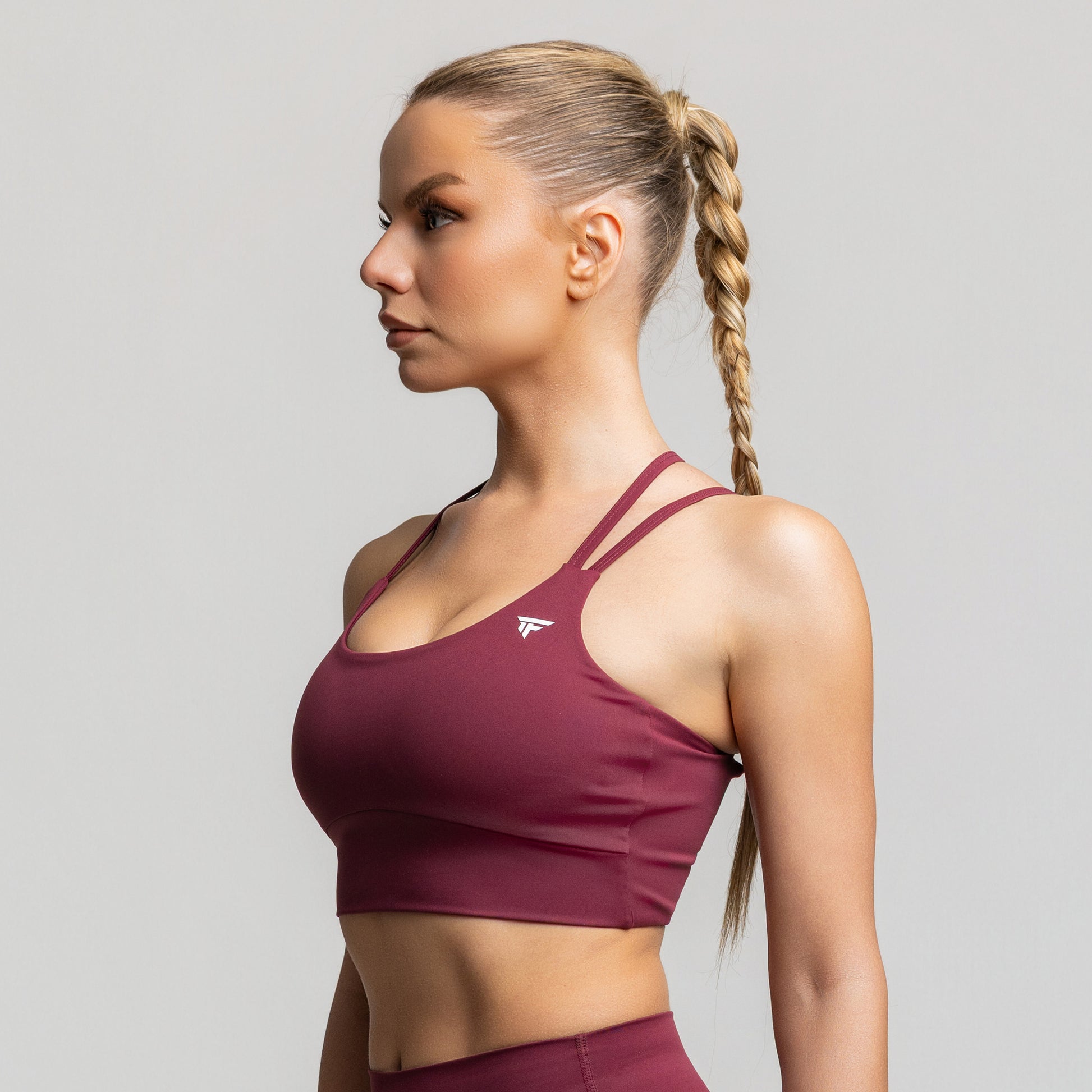 TONEFIT women’s criss-cross back sports bra in deep plum – side profile highlighting fit