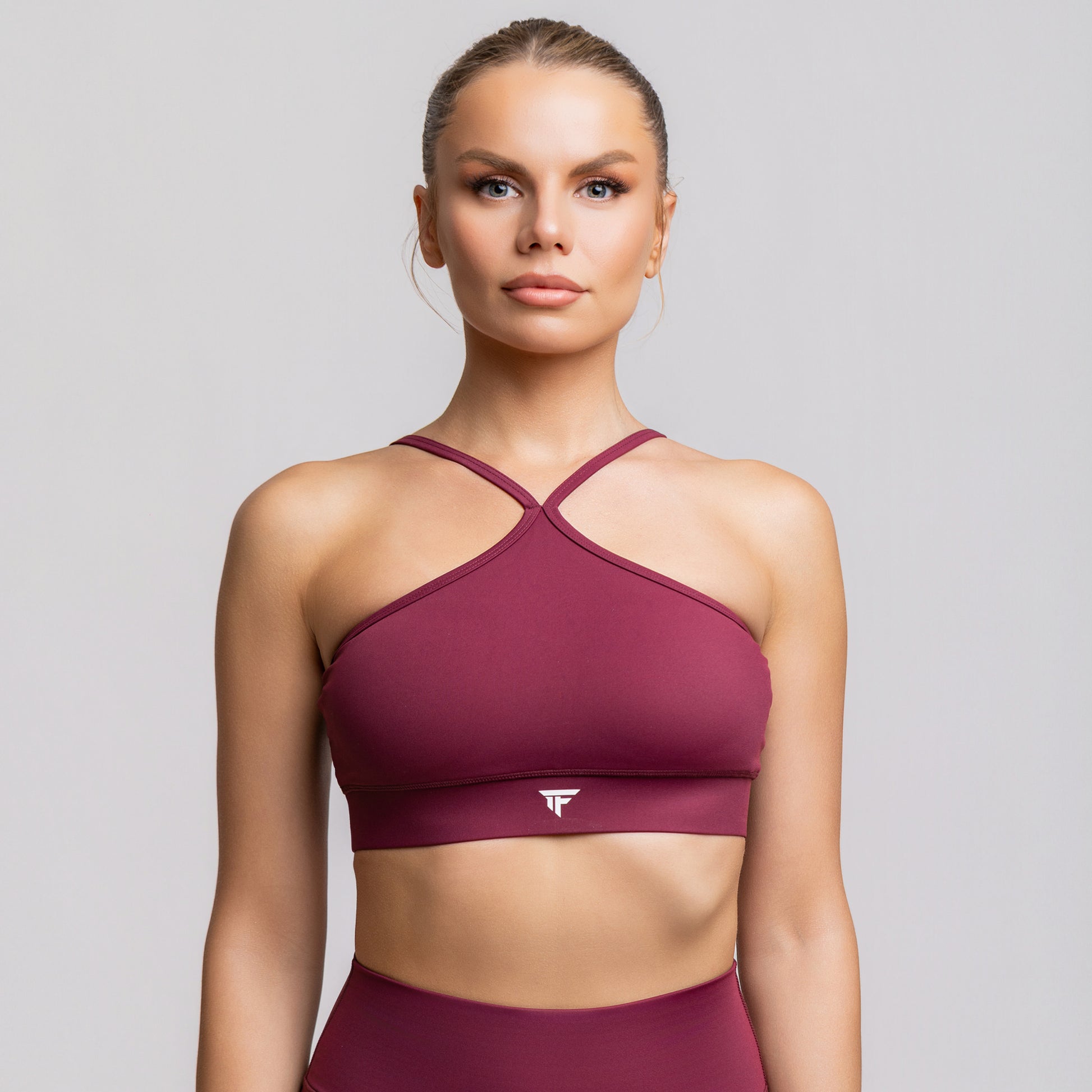 TONEFIT women’s halter strap crop bra in deep plum – front view with crossover neckline and flattering fit
