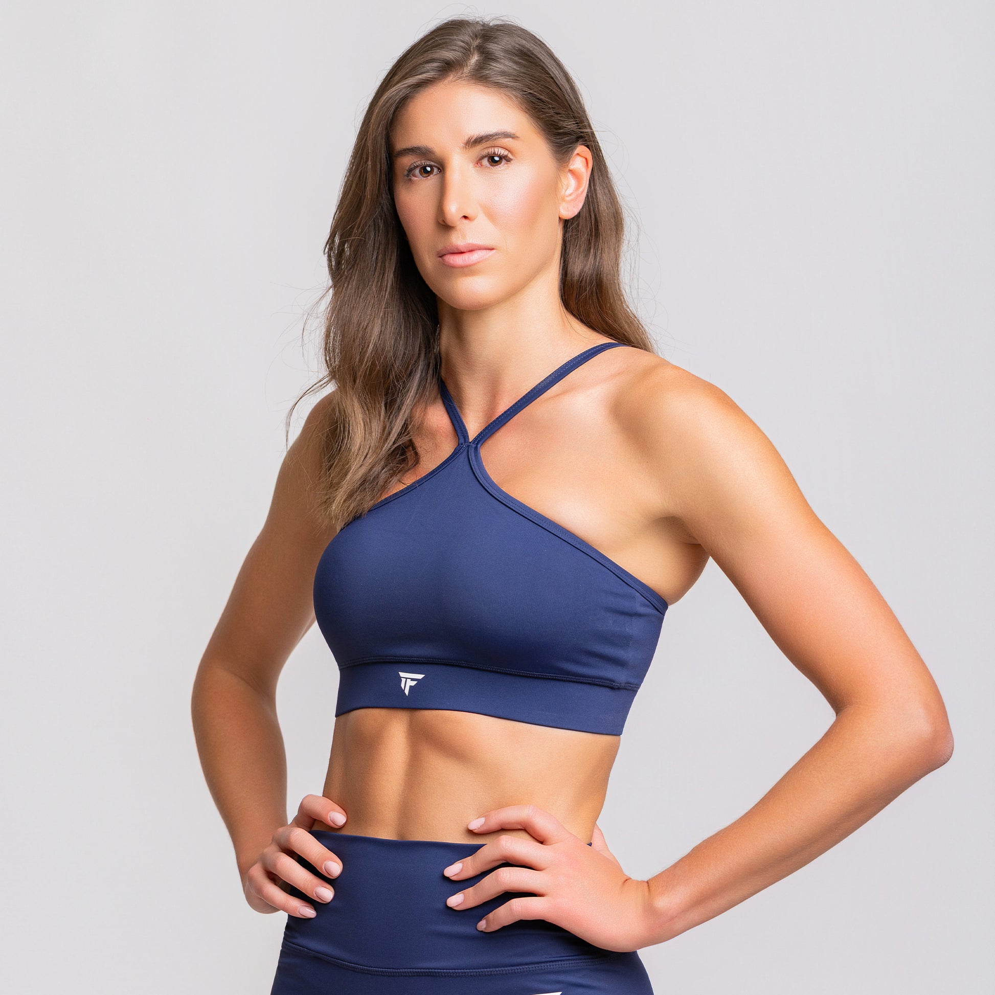 TONEFIT halter strap crop bra in sapphire blue – side close-up showing shoulder fit and bust support