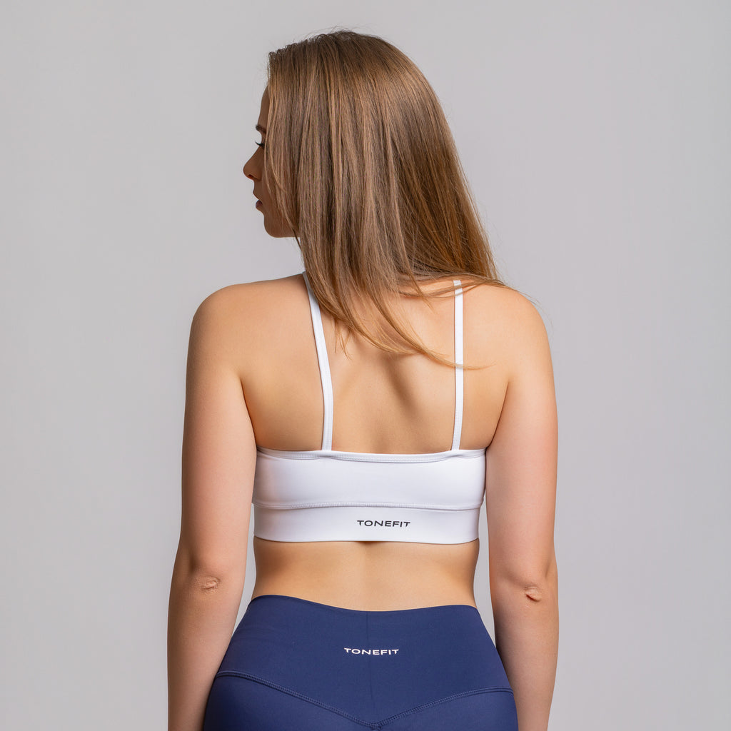 TONEFIT women’s halter strap crop bra in white – back view showing minimal strap design and logo