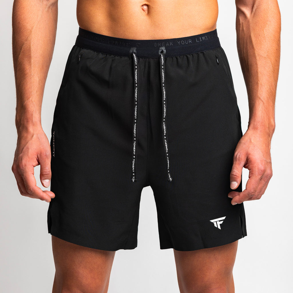 Close-up front view of TONEFIT men's black performance shorts showing logo and drawstring 