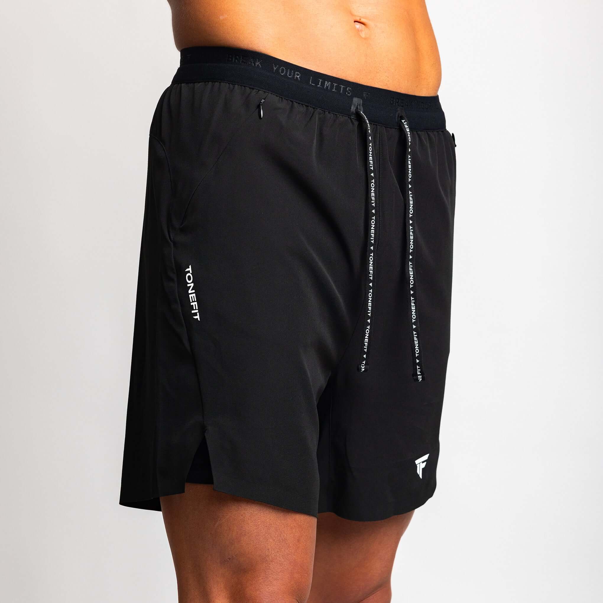 2-in-1 hybrid training shorts in black, designed for elite athletes, showcasing performance and durability by TONEFIT.